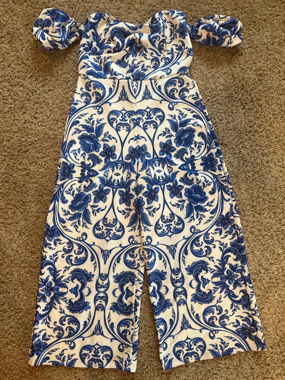 Boohoo blue and white off the shoulder porcelain print jumpsuit.